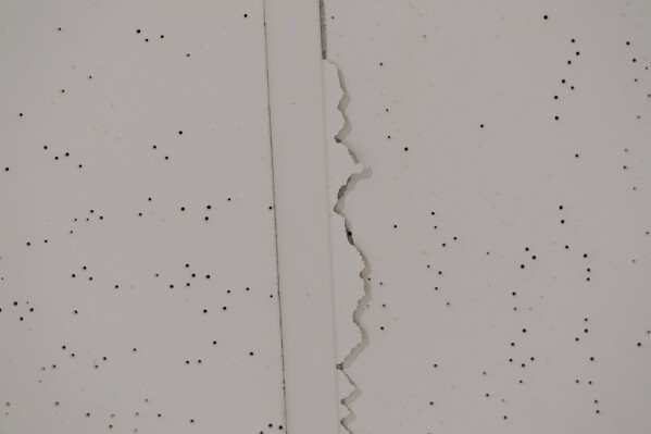Cracks are seen in a ceiling at Smith Tower Apartments on Monday, March 10, 2025, in Vancouver, Wash. (AP Photo/Jenny Kane)