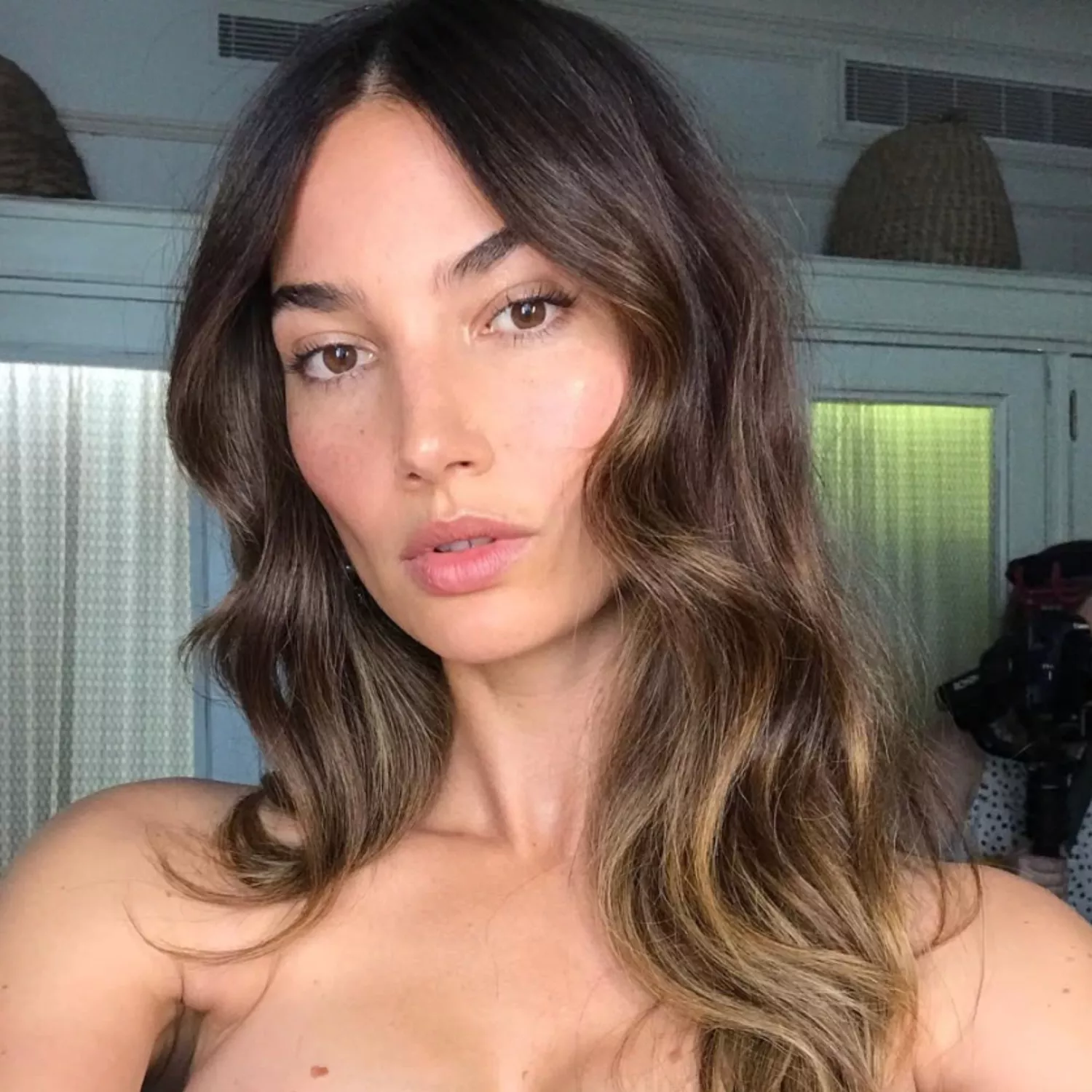 Woman with brown hair and balayage.