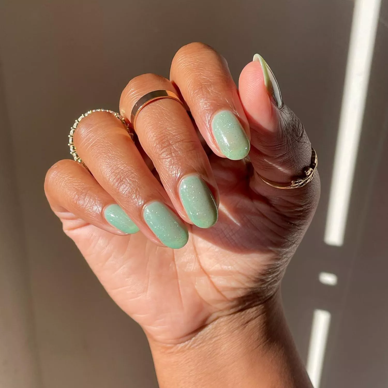 Pistachio green syrup nails with silver glitter