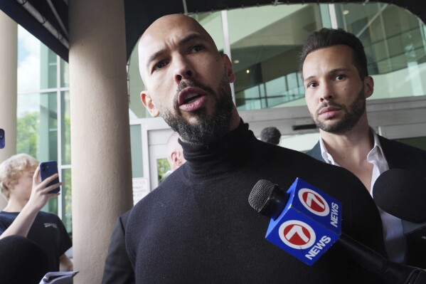 Influencer brothers Andrew and Tristan Tate arrive, Thursday, Feb. 27, 2025, in Fort Lauderdale, Fla. (AP Photo/Marta Lavandier, File)